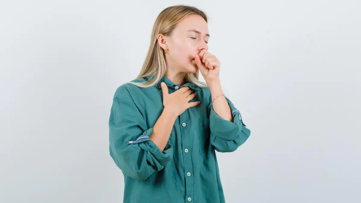 young lady green shirt suffering from cough looking sick 176474 81984.jpg