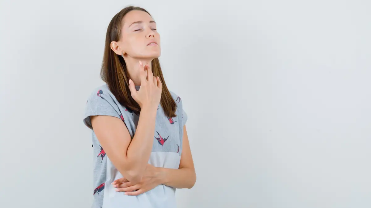 young woman t shirt touching sore throat with fingers front view 176474 15331.jpg