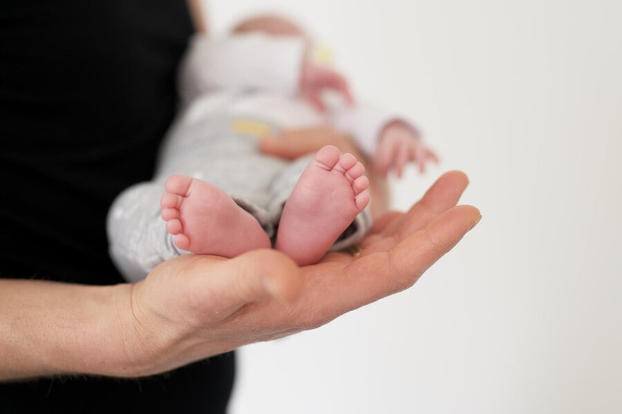 selective focus shot person carrying newborn baby 181624 53608