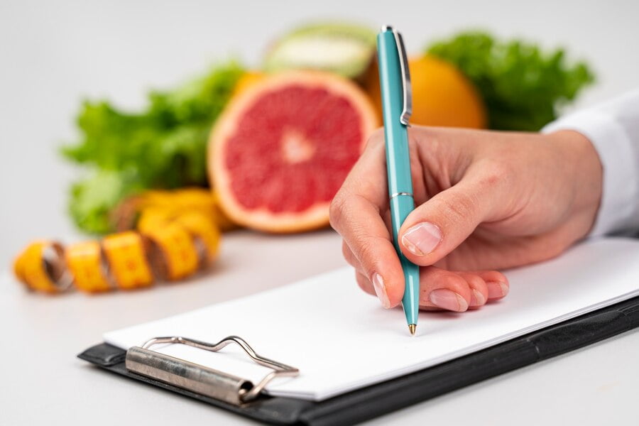 woman writing blurred fruit 23 2148256181