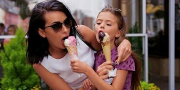 -girl-eating-ice-cream-street_613910-12186
