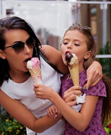 -girl-eating-ice-cream-street_613910-12186