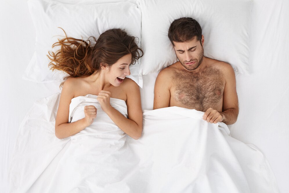 picture adult european bearded man excited woman lying bed peeping white blanket 273609 8278