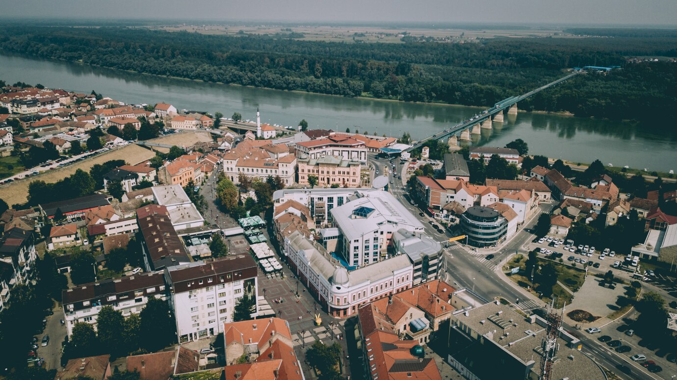 aerial shot city buildings with bridge river near trees plants 181624 1661