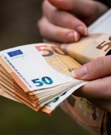 closeup-female-hands-counting-euro-banknotes-world-money-inflation-economy-concept_181624-57097