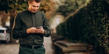 young-man-adult-student-talking-phone