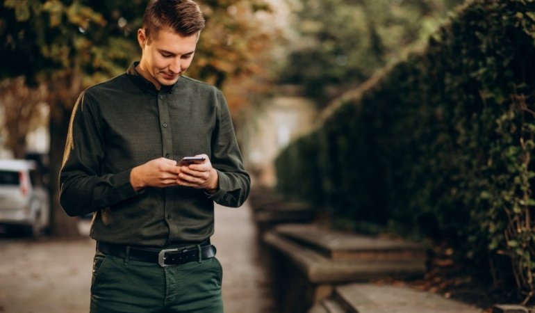 young-man-adult-student-talking-phone